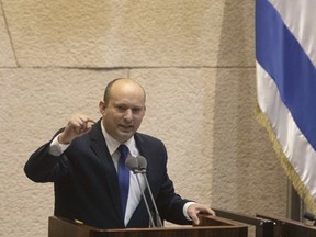 Naftali Bennett, leader of the Yamina party, speaks at the Knesset in Jerusalem, before being sworn in as Israel's new prime minister, on June 13.