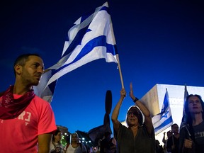 Israelis rally to support a new coalition government on May 31, 2021, in Tel Aviv.