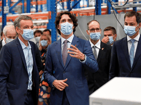 Prime Minister Justin Trudeau takes a tour of pharmaceutical company Pfizer with Belgian counterpart Alexander De Croo, right, in Puurs, Belgium June 15, 2021.