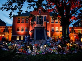 A makeshift memorial is seen outside the former Kamloops Indian Residential School, where the remains of 215 children have been discovered in unmarked and undocumented graves, on June 2, 2021. Several Kahnawake residents came forward after the discovery with allegations that Rev. Leon Lajoie had abused them.