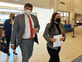 Intergovernmental Affairs Minister Dominic LeBlanc and MP Jenica Atwin arrive at a news conference in Fredericton on June 10, 2021 after Atwin announced she was leaving the Green Party to join the Liberals.