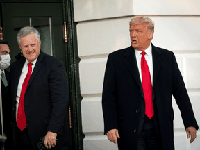 U.S. President Donald Trump departs with White House Chief of Staff Mark Meadows from the White House for an election rally, October 21, 2020.