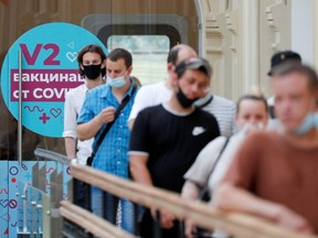 People line up to receive vaccine against COVID-19 outside a vaccination centre in the State Department Store, GUM, in central Moscow, Russia, on June 25, 2021.