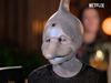 A person disguised as a dolphin in the new Netflix series Sexy Beasts.
