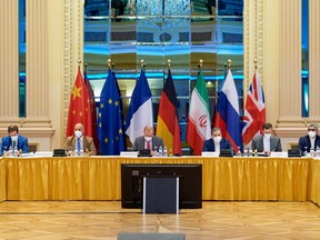 European External Action Service (EEAS) Deputy Secretary General Enrique Mora and Iranian Deputy at Ministry of Foreign Affairs Abbas Araghchi wait for the start of talks on reviving the 2015 Iran nuclear deal in Vienna, Austria on June 20, 2021.
