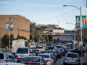 Cars wait at a traffic light on 7th street in Austin, Texas, U.S.