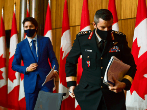 Prime Minister Justin Trudeau and Major-General Dany Fortin leave a press conference in Ottawa on Dec. 10, 2020.