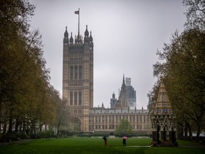 The Union Flag, also known as the Union Jack, flies above the Houses of Parliament in London, U.K., on Tuesday, April 9, 2019.