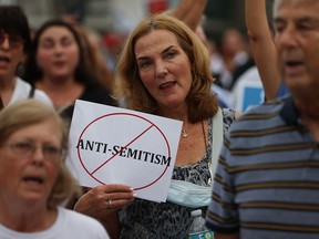 Rabbi Jaime Aklepi joins with others for an interfaith rally against anti-Semitism on June 3, 2021, in Miami Beach, Fla. The rally was held as crimes against the Jewish community have risen in recent weeks.