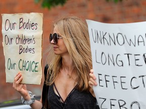 Anti-vaccine demonstrators protest outside a pop-up coronavirus vaccination clinic at the Bronx Writing Academy school in New York City, June 4, 2021.