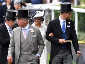John Warren,, Prince Charles, Prince of Wales, Meghan, Duchess of Sussex and Prince Harry, Duke of Sussex attend the first day of Royal Ascot on June 19, 2018 in Ascot, England.