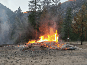 The burning remains of a church in Chopaka, B.C., on Saturday, June 26, 2021.