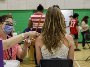 An adolescent receives a dose of the Pfizer-BioNTech Covid-19 vaccine at a clinic in Toronto, Ontario, on Wednesday, May 19, 2021.