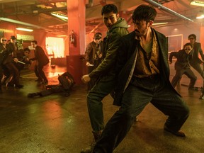 From left, Henry Golding and Andrew Koji fight each other while they have the chance in Snake Eyes.