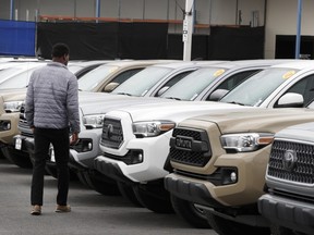 A salesman views used Toyota Motor Corp. vehicles at the Brent Brown Toyota dealership in Orem, Utah, U.S. in April 2020.