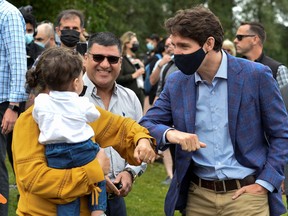 Canada's Prime Minister Justin Trudeau greets people at Town Centre Park in Coquitlam, British Columbia, Canada July 8, 2021.