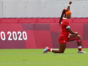 Tokyo 2020 Olympics - Rugby Sevens - Women - Final 9-10 - Canada v Kenya - Tokyo Stadium - Tokyo, Japan - July 31, 2021. Charity Williams of Canada takes a knee before the game.