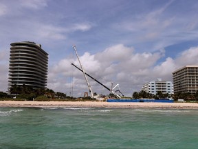 Champlain Towers South is no more; it is just a gap between condominium buildings after a controlled demolition on July 5 in Surfside, Fla.