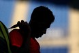 Felix Auger-Aliassime of Team Canada leaves the court after defeat in his Men's Singles First Round match against Max Purcell of Australia on day two of the Tokyo 2020 Olympic Games at Ariake Tennis Park.