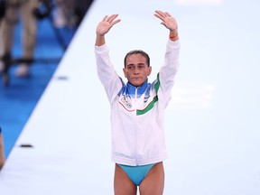 TOKYO, JAPAN - JULY 25: Oksana Chusovitina of Team Uzbekistan waves after competing on vault during Women's Qualification on day two of the Tokyo 2020 Olympic Games at Ariake Gymnastics Centre on July 25, 2021 in Tokyo, Japan. (Photo by Laurence Griffiths/Getty Images)