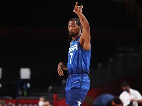 Kevin Durant signals to his teammates before the start of their game against France in the Men's Preliminary Round Group B game on day two of the Tokyo 2020 Olympic Games at Saitama Super Arena on July 25, 2021 in Saitama, Japan. (Photo by Gregory Shamus/Getty Images)