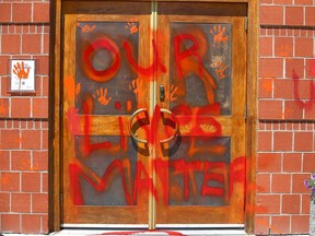 Graffitti and damage is shown at St. Bonaventure Catholic Church in Calgary on July 1.