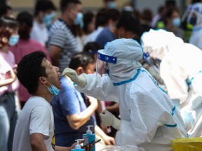 A resident receives nucleic acid test for the COVID-19 coronavirus in Nanjing, in eastern Jiangsu province on July 21.