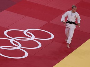 Canada's Jessica Klimkait (white) and Poland's Julia Kowalczyk compete in the judo women's -57kg quarterfinal bout during the Tokyo 2020 Olympic Games at the Nippon Budokan in Tokyo on July 26, 2021. (Photo by Jack GUEZ / AFP) (Photo by JACK GUEZ/AFP via Getty Images)
