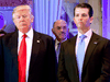 Allen Weisselberg stands behind U.S. President-elect Donald Trump and Donald Trump Jr. at Trump Tower in New York on January 11, 2017.