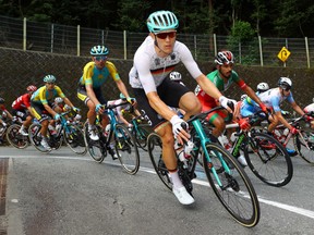 Germany's Nikias Arndt (front) rides in the pelton during the men's cycling road race of the Tokyo 2020 Olympic Games finishing at the Fuji International Speedway in Oyama, Japan, on July 24, 2021.