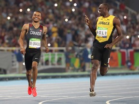 Andre de Grasse of Canada and Usain Bolt of Jamaica run in the men's 200m semifinal at the Rio 2016 Olympics in Rio de Janeiro, August 17, 2016.