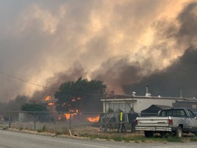 Smoke rises above the small western Canadian town of Lytton after wildfires forced its residents to evacuate, in Lytton, British Columbia, Canada June 30, 2021.