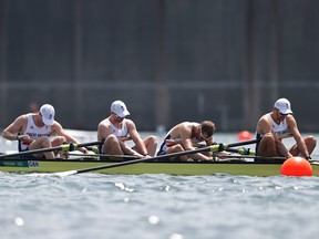 Oliver Cook, Matthew Rossiter, Rory Gibbs and Sholto Carnegie of Team Great Britain react after coming in fourth during the Men's Four Final on day five of the Tokyo 2020 Olympic Games at Sea Forest Waterway on July 28, 2021 in Tokyo, Japan.