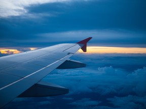 Wing of an airplane in the sunset.