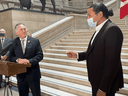 Alan Lagimodiere, left, Manitoba's Indigenous relations minister, is confronted by Opposition NDP Leader Wab Kinew shortly after being sworn in to cabinet at the Manitoba legislature in Winnipeg on Thursday, July 15, 2021.