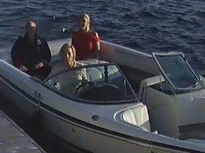 A screenshot of security video showing Linda O'Leary, wife of celebrity investor Kevin O'Leary, driving their speedboat to a neighbour's cottage on the evening of a fatal boat crash. Kevin is in a black shirt, Linda in blue jeans and a white top and Allison Whiteside, an O'Leary family friend, is in red top.