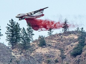 A Conair airtanker drops fire retardant on part of the Nk'Mip Creek wildfire near Osoyoos, British Columbia, Canada July 20, 2021.