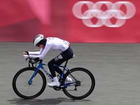Refugee Olympic Team's Masomah Ali Zada competes in the women's cycling road individual time trial during the Tokyo 2020 Olympic Games at the Fuji International Speedway in Oyama, Japan, on July 28, 2021.