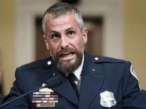 Washington Metropolitan Police Department officer Michael Fanone bangs his fist on the witness table as he testifies during the House Select Committee investigating the January 6 attack on the U.S. Capitol on July 27, 2021.