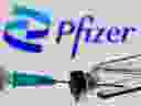 Syringe and vial are seen in front of a displayed Pfizer logo in this illustration taken on June 24, 2021. 
