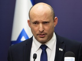 Israeli Prime Minister Naftali Bennett looks on as he speaks during his Yamina party faction meeting at the Knesset, Israel's parliament, in Jerusalem July 5, 2021.