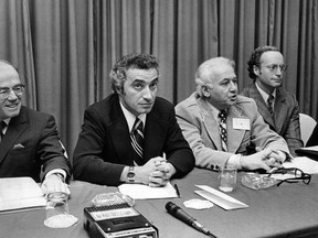 Members of the Committee for an Independant Canada speak to reporters following their three-day annual meeting in Ottawa on March 11, 1973. From the left are: Jack Biddell, Mel Hurtig, Eddie Goodman, John Trent and Bob Page.