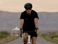 In a still image from a video, Richard Branson arrives by bicycle to Spaceport America near Truth or Consequences, New Mexico, U.S. on July 5, 2021.