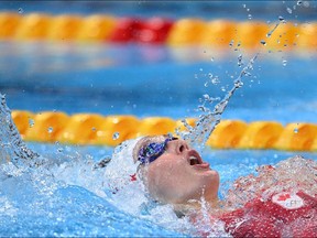 Canada's Taylor Ruck competes in a heat for the women's 200m backstroke swimming event during the Tokyo 2020 Olympic Games at the Tokyo Aquatics Centre in Tokyo on July 29, 2021. (Photo by Oli SCARFF / AFP)