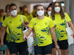 Members of Australian team walk to take the COVID antigen test at Narita airport in Tokyo.