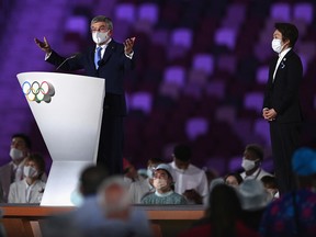 Thomas Bach, IOC President makes a speech as Seiko Hashimoto, Tokyo 2020 President looks on during the Opening Ceremony.