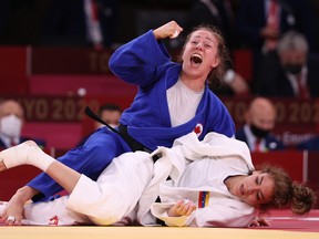 Catherine Pinard-Beauchemin of Team Canada celebrates after defeating Anriquelis Barrios of Team Venezuela during the Women’s Judo 63kg Contest.