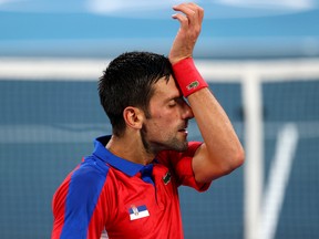 Novak Djokovic of Serbia reacts during his semi-final match against Alexander Zverev of Germany.