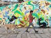 A woman walks her dog in the Israeli coastal city of Tel Aviv.