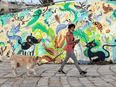 A woman walks her dog in the Israeli coastal city of Tel Aviv.